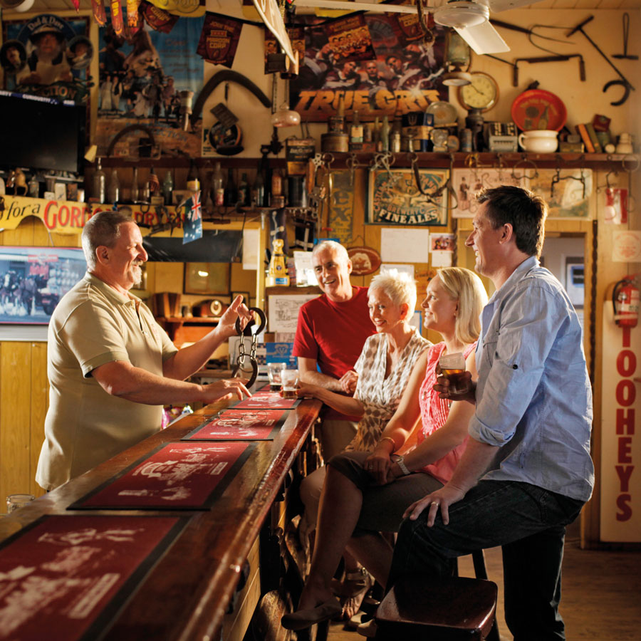 Guests talking to the staff over pub counter